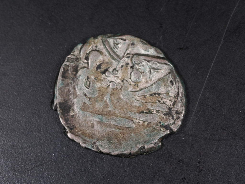 Unidentified Islamic silver coin-19mm0