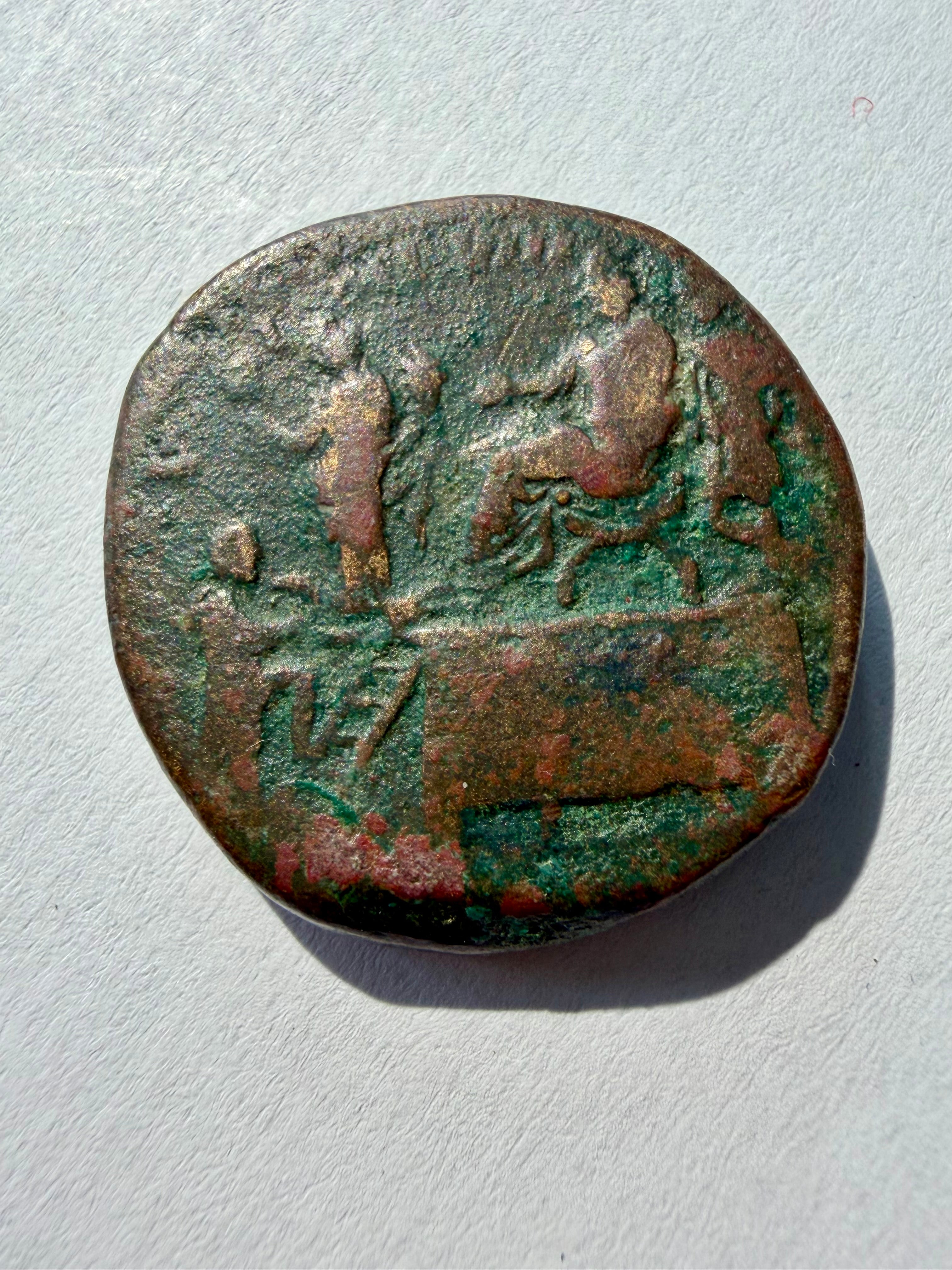 Commodus sestertius. Liberalitas-Commodus seated on chair