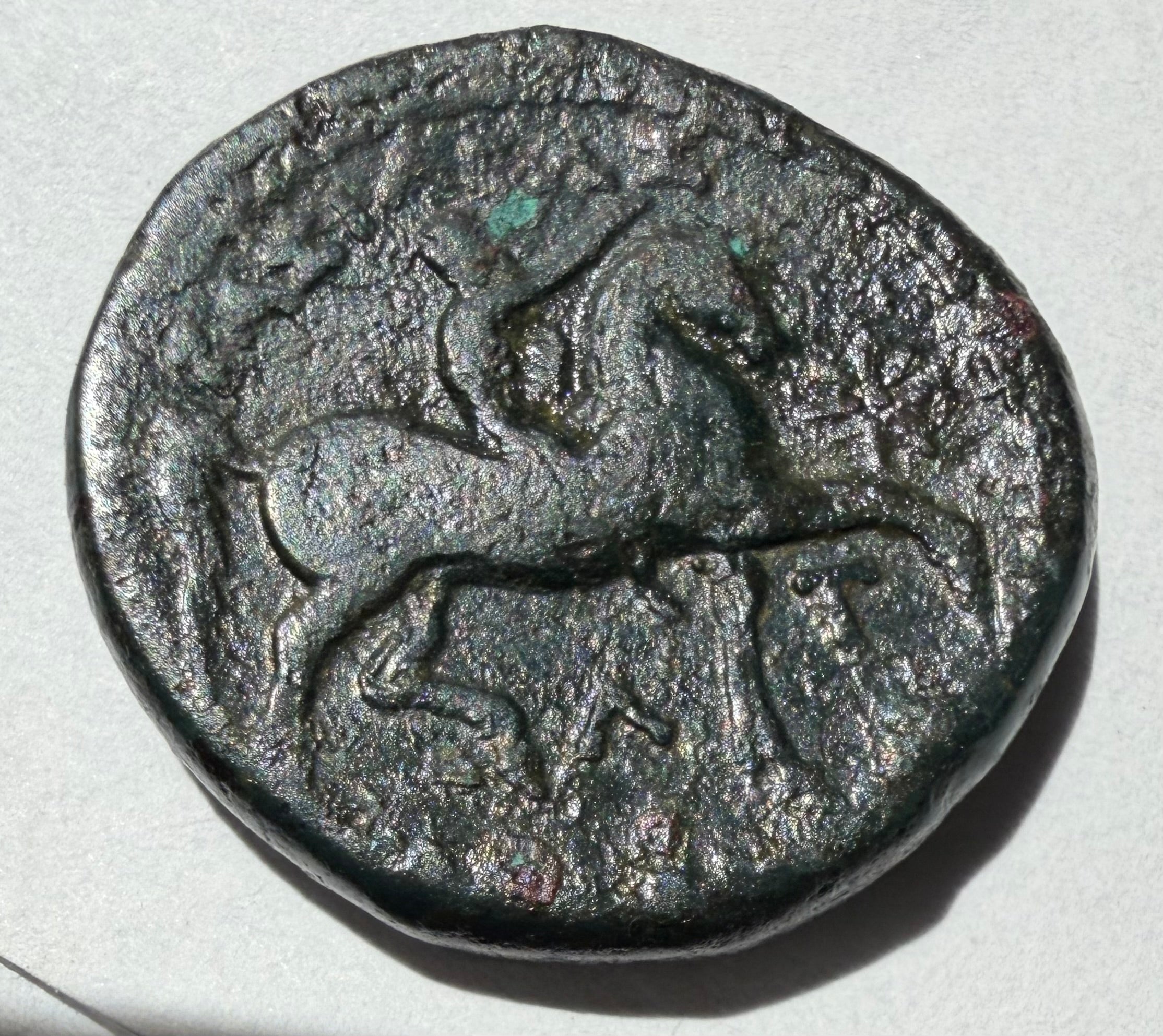 Kassander-305-297 BC.Head of young Hercules facing right/Nude youth riding a horse right AE20 unit