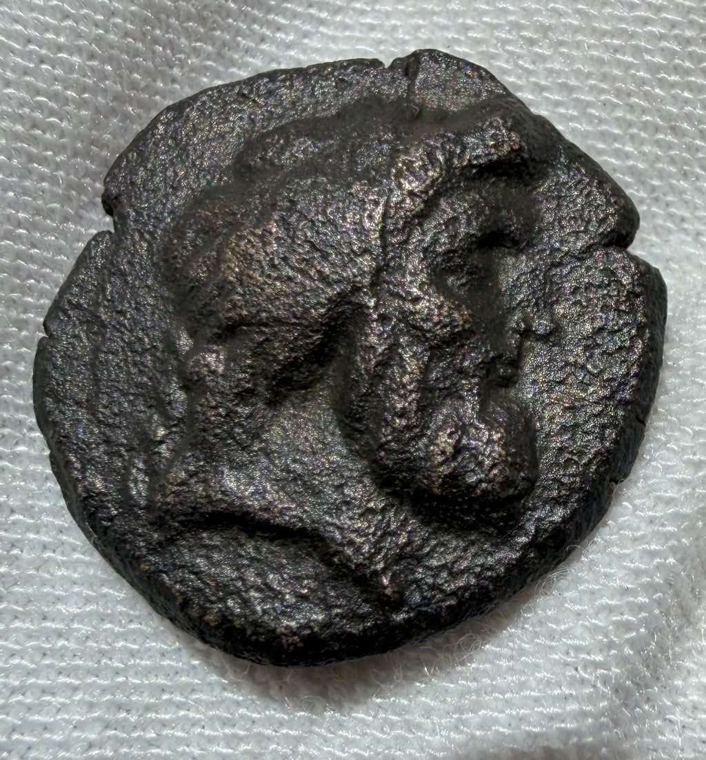 Alexander II Zabinas AE17 Head of Zeus/ Apollo standing (128–122 BC)