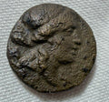 AE13 Thessalian league,Apollo/Athena Itonia striding right
